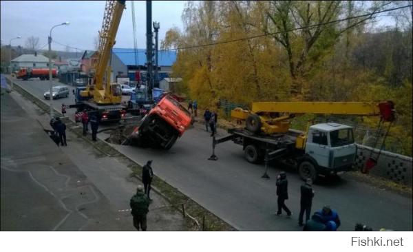 КамАЗ засосало в дорогу