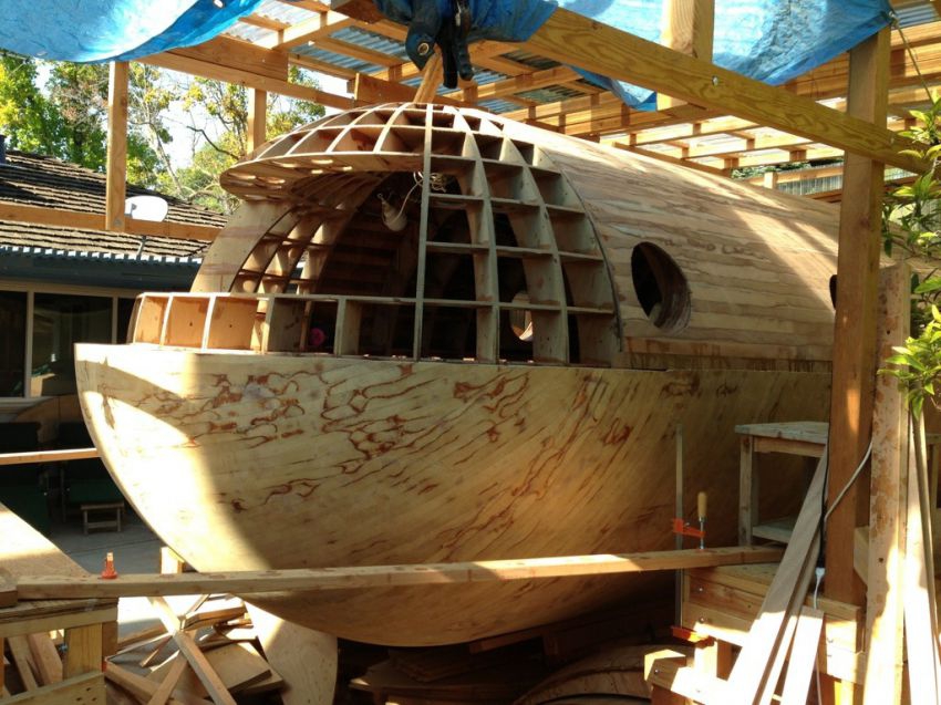 A designer  is constructing a boat that could be tsunami-proof