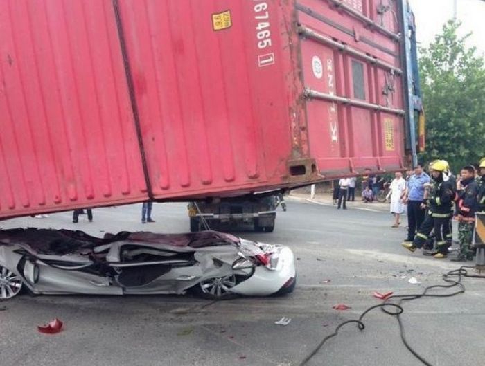 Car Gets Squashed By A Container Truck