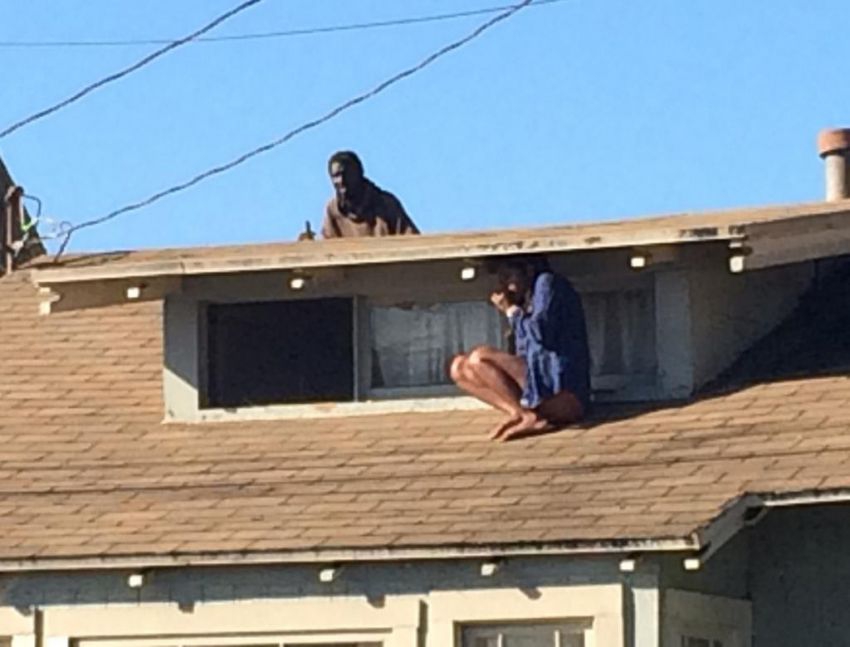 Woman Hides On Her Roof While Intruder Searches For Her