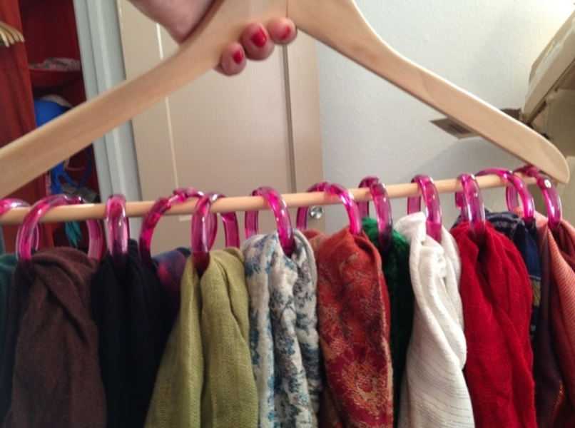 Attach shower curtain rings to a hanger to store scarves and keep them from getting wrinkled.