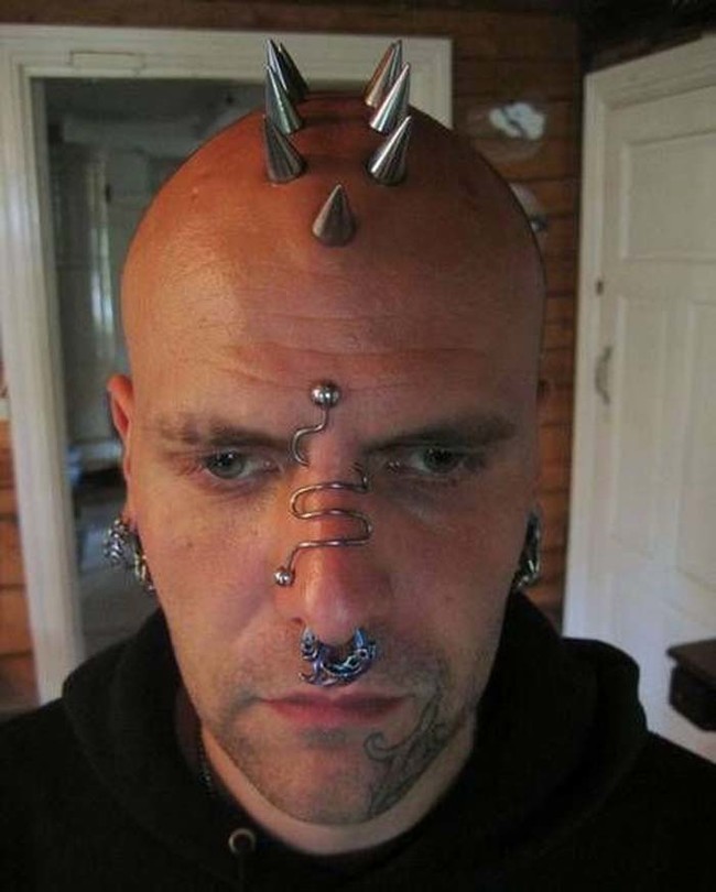 Those are some nice cranial piercings. They probably get pretty cold in the winter.