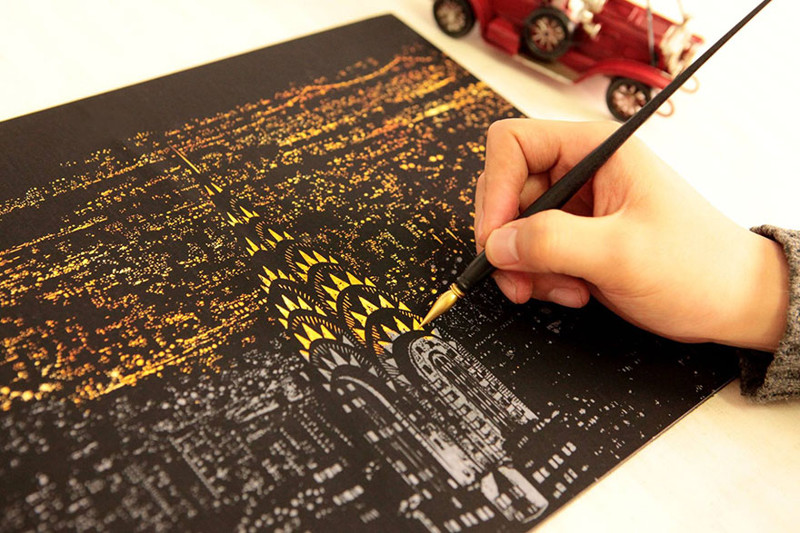 New Coloring Book Lets You Scratch Off Surface To Reveal Nightscrapes