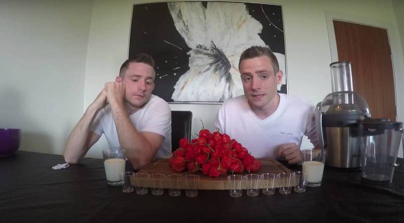 Here's The Twin Brothers sitting in front of 130 of the world's hottest peppers. The one on the left looks more than remorseful of this decision.