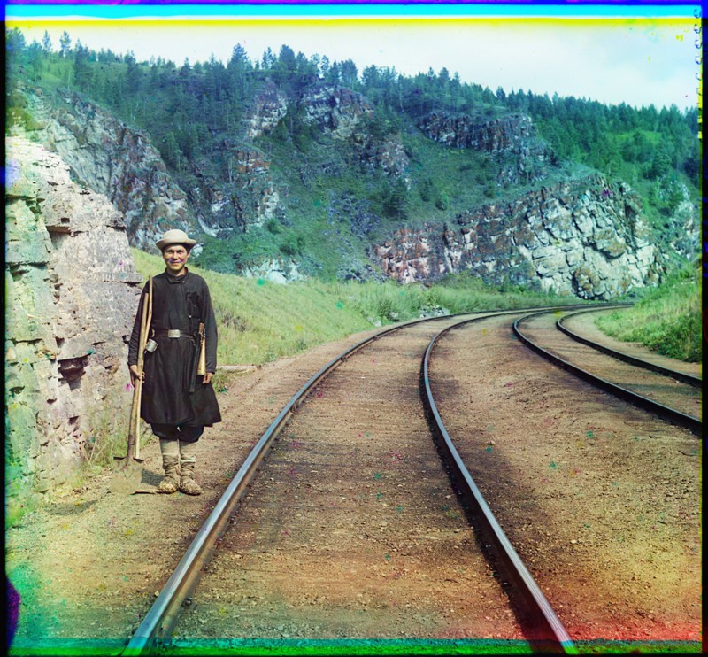 A switch operator poses on the Trans-Siberian Railroad near the town of Ust Katav on the Yuryuzan River. (1910)