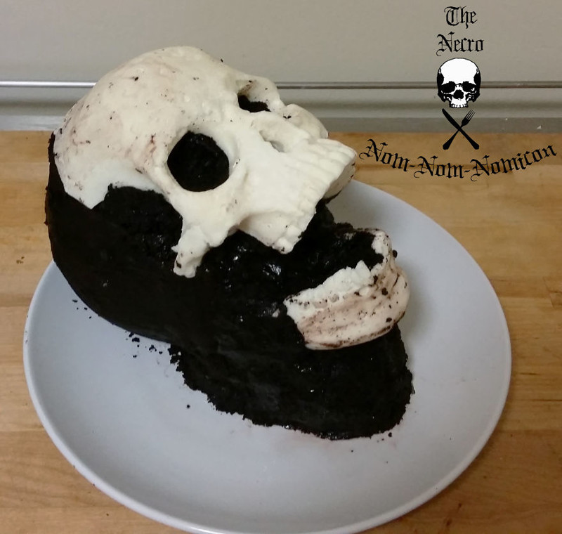 Once the cake is cool, I attach the chocolate skull using chocolate buttercream frosting