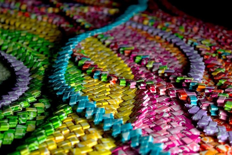 After enough were saved I organized them into colors, ironed them, folded them into links, and made candy wrapper chains