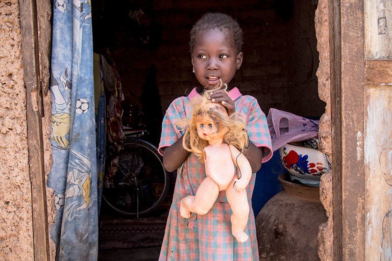 In a Burkinabe home living on $45/month per adult, the favorite toy is a broken plastic doll