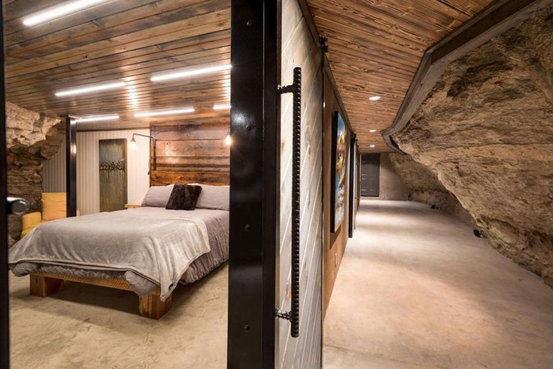 Each of the 4 bedrooms is unique, offering queen-sized beds, exposed cavern walls, and lavish bathrooms