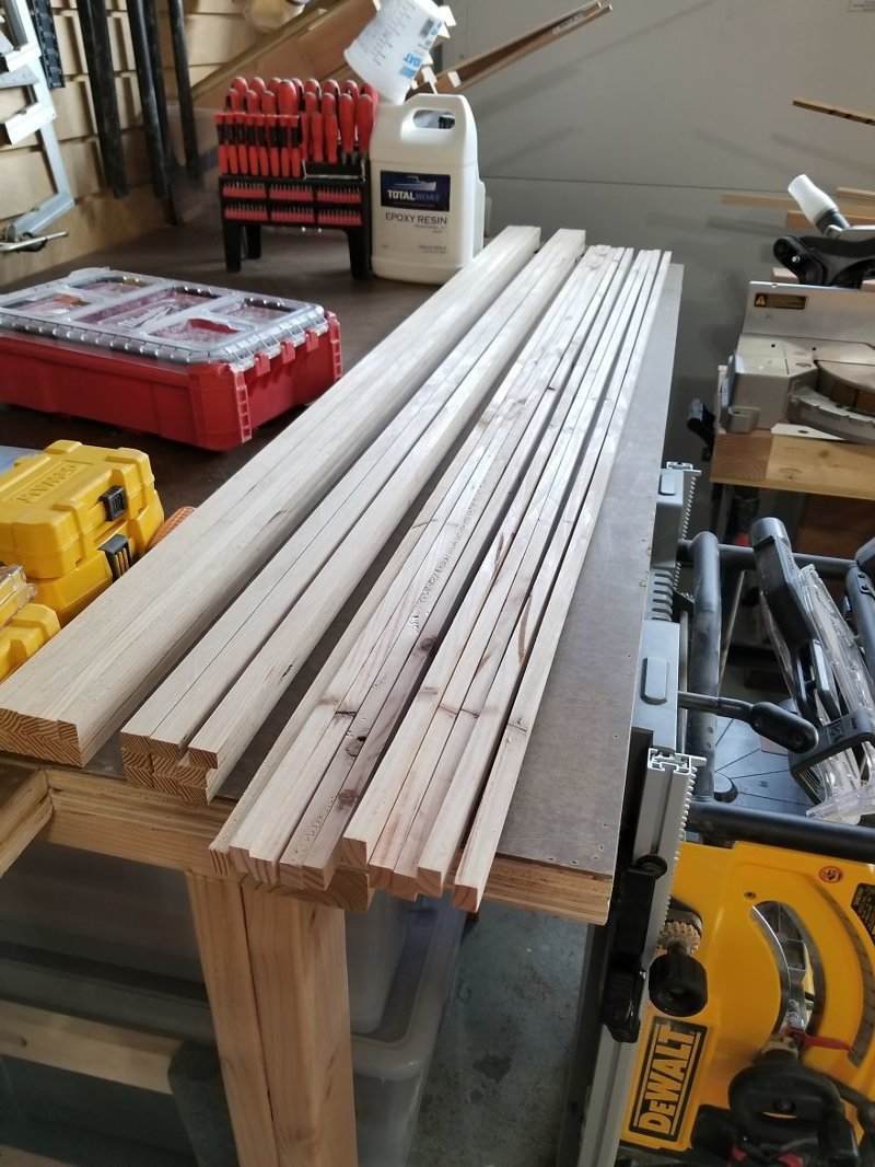 I cut some 3/4 by 1/2 inch strips from left over 2x4s to become the window trim. Here you see the difference between big-box 2×4 (right) and the quality 2×4 from the lumber yard